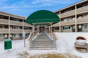 a building with a staircase in the snow in front of it at Fall Line W212 in Newry