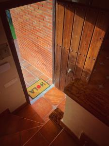 an open door to a room with a brick wall at Villa EMMA - Chalet familiar con jardín y parking en Málaga in Málaga