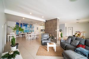 a living room with a couch and a table at Bella Luna Bed and Breakfast in Walvis Bay