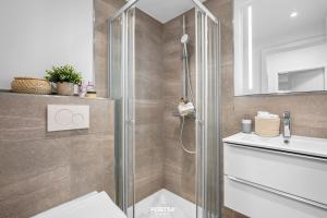 a bathroom with a shower and a sink at Ferienwohnung Seeblick 203 Büsum in Büsum +12 photos