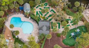 an aerial view of a mansion with a swimming pool at Boutique Coastal Retreat in Edisto Island