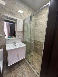 a bathroom with a sink and a shower at Baku City Inn Boutique Nizami Hotel in Baku +52 photos