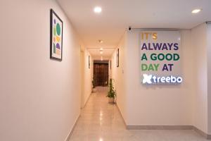 a hallway with a sign that reads its always a good day at kiegogo at Treebo Brixton Luxe in Bangalore