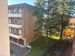 an aerial view of a building with trees next to it at GuestHouse Modena Buon Pastore in Modena