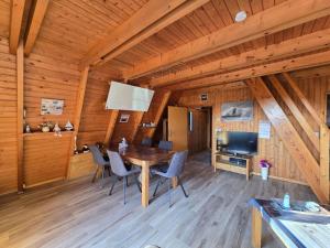 a dining room with a table and chairs at Haus Stern Carolinensiel in Carolinensiel
