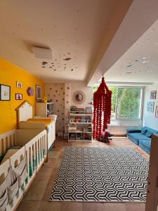 a nursery with a crib and a christmas tree at Maison au coeur de Guéthary in Guéthary
