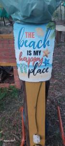 a sign that says the beach is my happy place at recanto de pepe 1 in Santa Vitória do Palmar