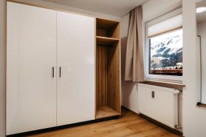 a closet in a room with a window at Schöne Aussicht in Riezlern