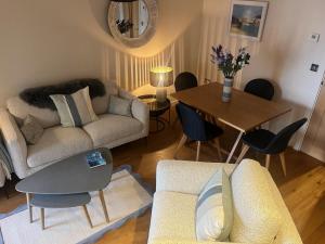 a living room with a couch and a table at 2 Bed in West Bay oc-wy487 in West Bay +16 photos