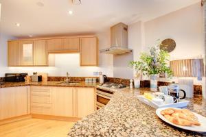 a kitchen with a counter with a plate of food on it at 2 Bed in West Bay oc-wy487 in West Bay