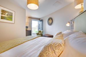 a bedroom with a large bed and a window at 2 Bed in West Bay oc-wy487 in West Bay