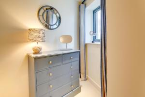 a bedroom with a dresser and a mirror at 2 Bed in West Bay oc-wy487 in West Bay