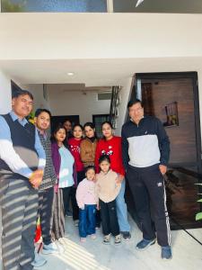 a group of people posing for a picture at Kozy Cottage udaipur in Udaipur