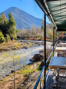a view of a river from a room with tables at Top Ourika in Aghbalou