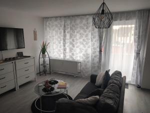 a living room with a couch and a table at Sweet Home in Hameln