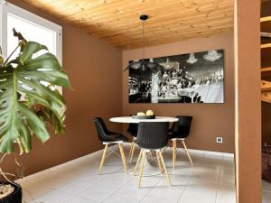 a dining room with a table and chairs at Revier beau jardin in Glarus +23 photos