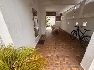 a hallway with a bike parked on the wall at La maison des vacances in Cap Malheureux