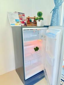 an open refrigerator with a plant inside of it at Kohmook sunrise beach in Ko Muk