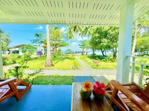 a view of the ocean from the porch of a house at Kohmook sunrise beach in Ko Muk