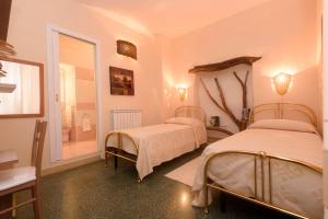Postel nebo postele na pokoji v ubytování Al Vecchio Corso B&B
