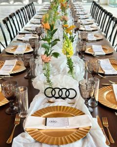 a long table with plates and vases on it at Yolihuani Relax Resort in Calvillo +201 photos