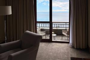a living room with a view of the ocean at Radisson Hotel Puerto Varas in Puerto Varas