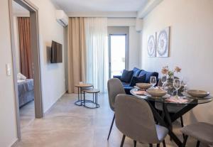 a living room with a table and a couch at Peace Home Trikala in Tríkala
