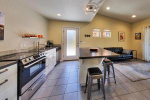 a large kitchen with a table and a couch at The Kayenta Flat in Moab UT in Moab