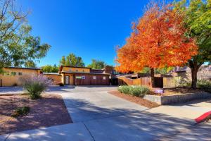 a driveway in front of a house with a tree at The Entrada Flat 1 in Moab UT in Moab