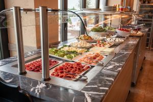 a buffet line with many different types of food at Hayat Hotels & Apartments in Rust