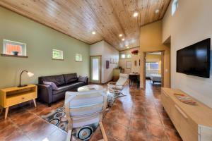 a living room with a couch and a table at The Wingate Flat 4 in Moab +9 photos