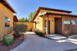 a building with a vase next to a walkway at The Wingate Flat 4 in Moab