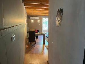 a hallway with a dining room with a table in a room at Lucky luke's hideaway in Heibloem +75 photos