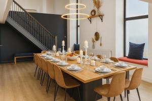 a dining room with a table with candles and chairs at Onyx House in Blackpool