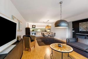 a living room with a couch and a tv at Fewo Spectrum in Überlingen