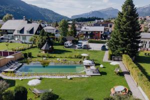 an aerial view of a resort with a swimming pool at Hotel Goldener Stern in Abtenau