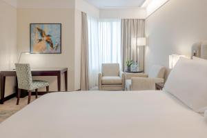 a hotel room with a bed and a desk at Crowne Plaza Porto by IHG in Porto +272 photos