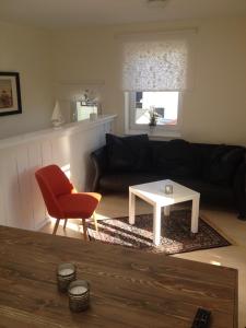 a living room with a couch and a coffee table at Ferienwohnung Odessa in Zinnowitz