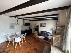 a living room with a couch and a table at Ferienwohnung Annika mit Sauna in Zinnowitz