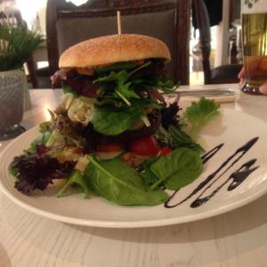 a sandwich and salad on a plate on a table at Ferienhaus Finnhütte in Zinnowitz