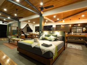 a bedroom with a large bed and a living room at Southern Drake Lodge in Drake +42 photos