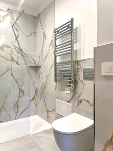 a bathroom with a toilet and a shower at Casa Bonomo in Castelbuono +85 photos
