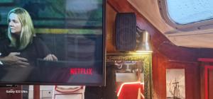 a tv with a picture of a woman on it at Ma Belle Lana, Chantereyne Marina in Cherbourg en Cotentin