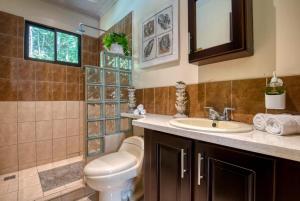 a bathroom with a toilet and a sink at AroCocles Apartments in Cocles +111 photos