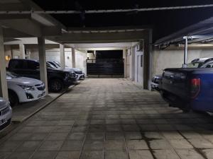 an empty parking garage with cars parked in it at Jr hospedaje in Paso de los Libres