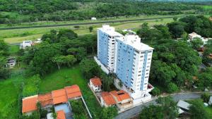 an aerial view of a large white building at Flat 8A confortável e completo próximo ao Hot Park e Pousada do Rio Quente in Rio Quente