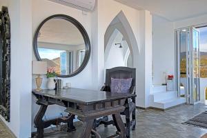 a dining room with a table and a mirror at The Moroccan Palace Entire Villa in El Sargento +64 photos