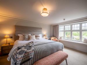 En eller flere senge i et værelse på Mill End Hotel