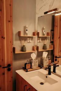 a bathroom with a sink and a mirror at Coração da Quinta in Algarvia +53 photos