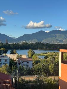 a view of a river with mountains in the background at Balkan Hostel in Tirana